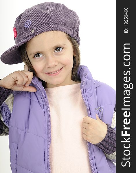 Young fashion model posing with purple cap and jacket. Young fashion model posing with purple cap and jacket