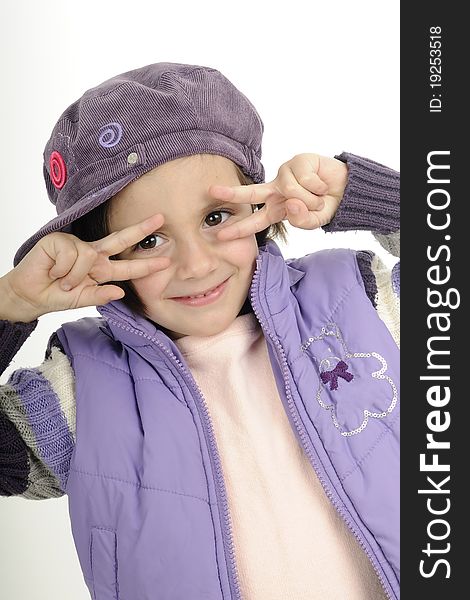 Young fashion model posing with purple cap and jacket. Young fashion model posing with purple cap and jacket