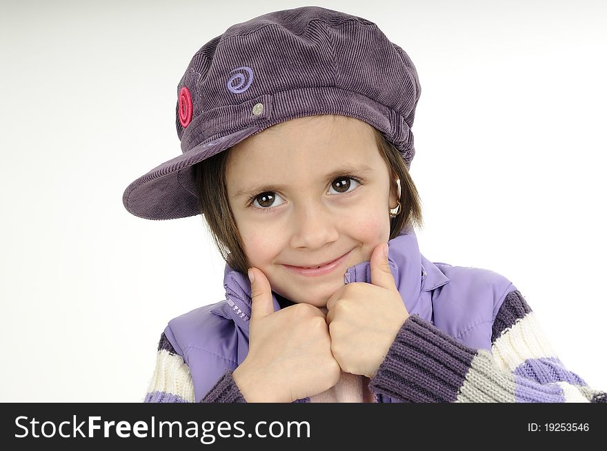 Funny girl posing with purple cap and jacket. Funny girl posing with purple cap and jacket