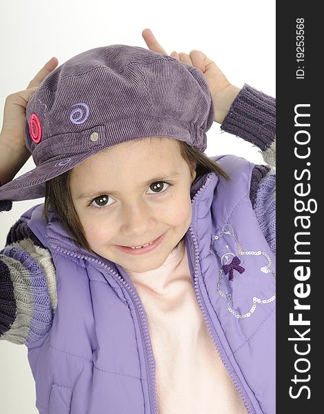 Young fashion model posing with purple cap and jacket. Young fashion model posing with purple cap and jacket