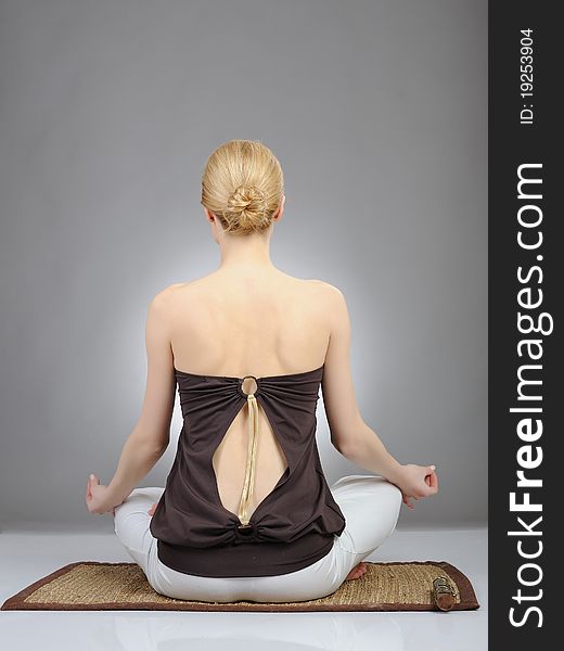 Creative portrait of young woman in yoga relaxation pose. Creative portrait of young woman in yoga relaxation pose