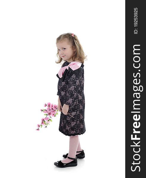 Pretty little girl in black elegant party dress with flowers. isolated