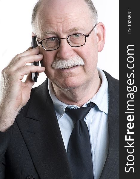 Businessman with his cellphone isolated on white