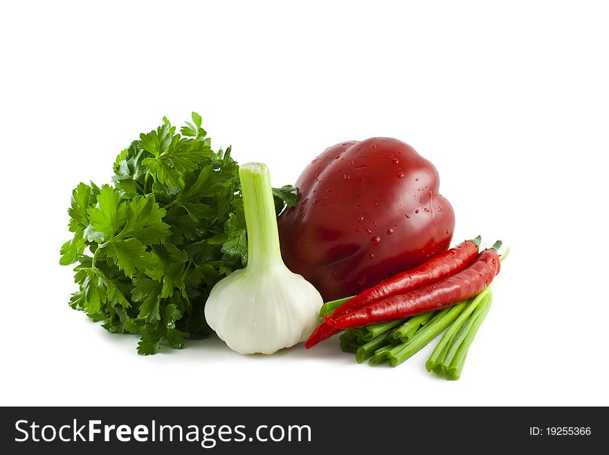 Parsley, onions, garlic and pepper on the isolated white background