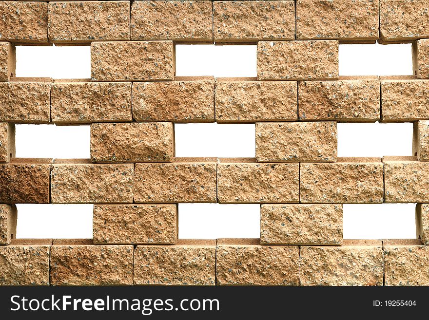 A stony brown brick wall