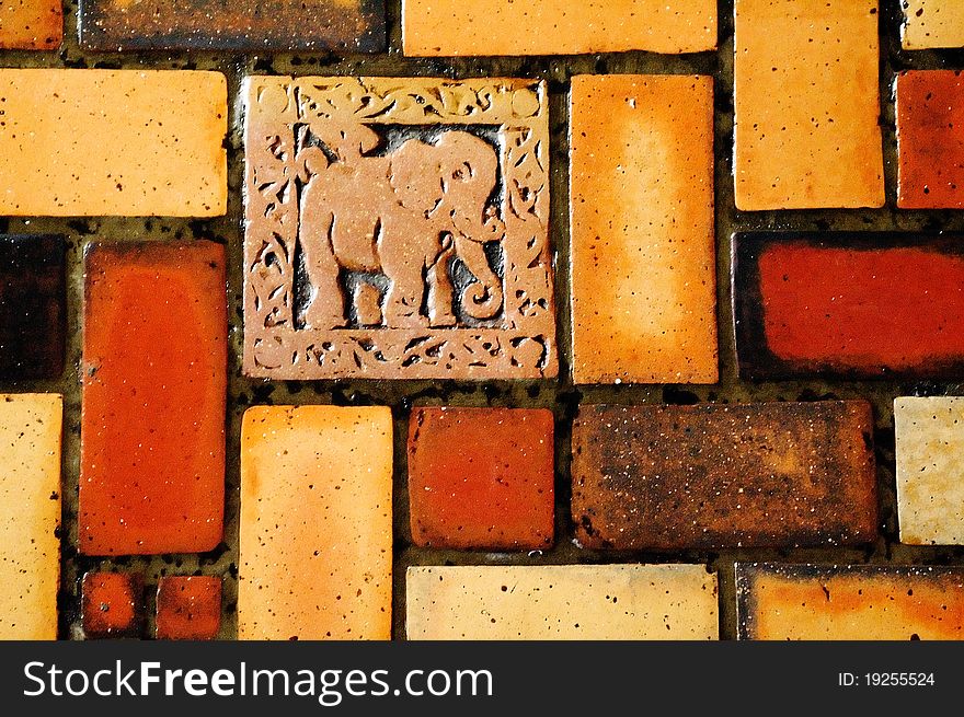 Colorful read orange tiles with elephant ornament. Colorful read orange tiles with elephant ornament