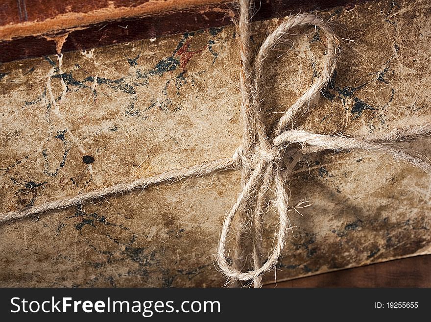 Archival book in a book-depository are tied up by a cord. Archival book in a book-depository are tied up by a cord.