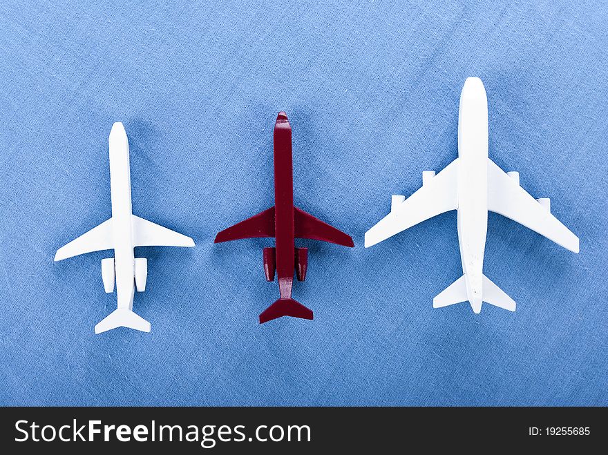 Some airplanes in one roe on blue background