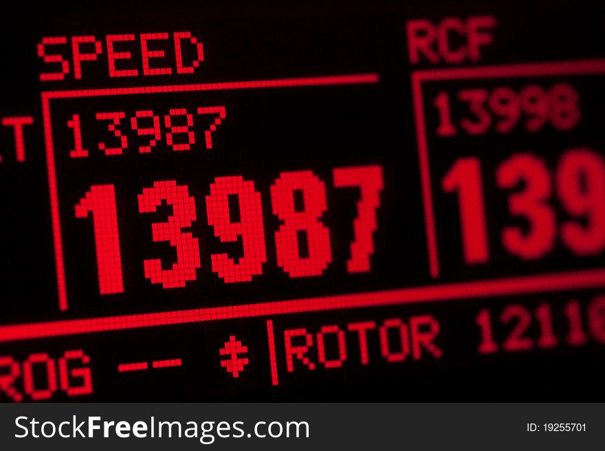 LCD red display of scientific centrifuge showing rotor speed. LCD red display of scientific centrifuge showing rotor speed