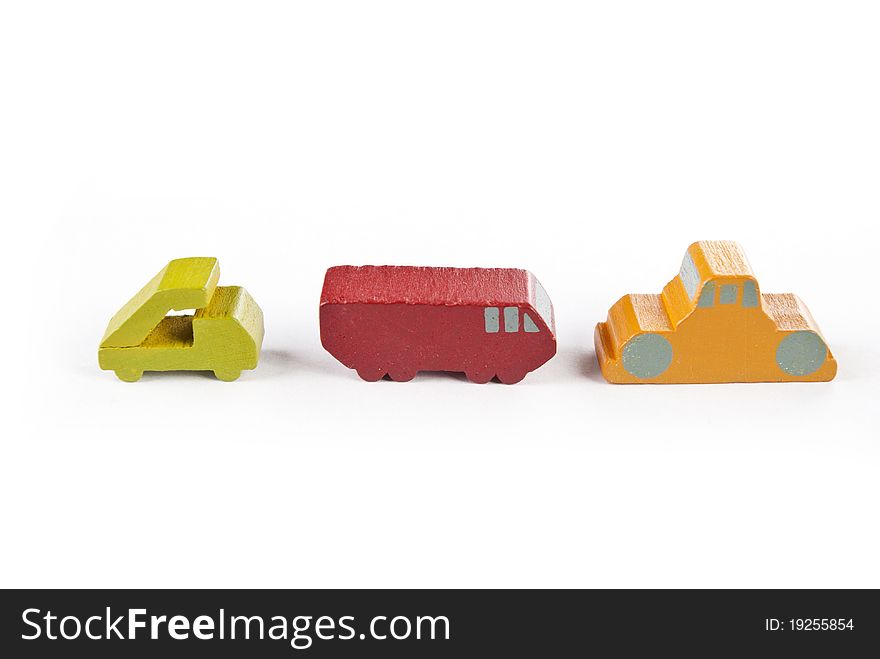 Some wooden toy cars on white