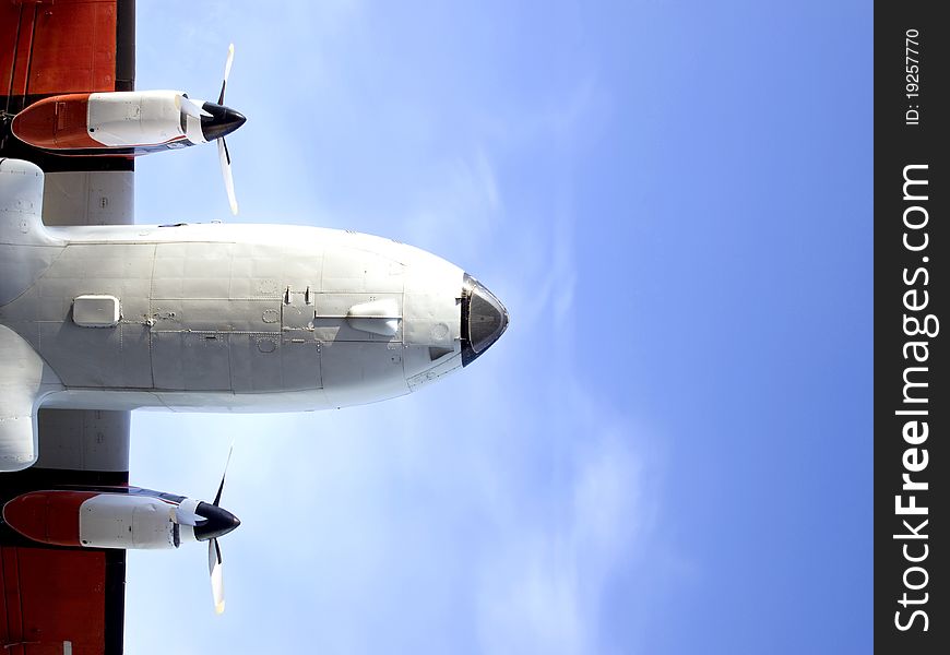 Fuselage and the two engine aircraft against the sky. Fuselage and the two engine aircraft against the sky