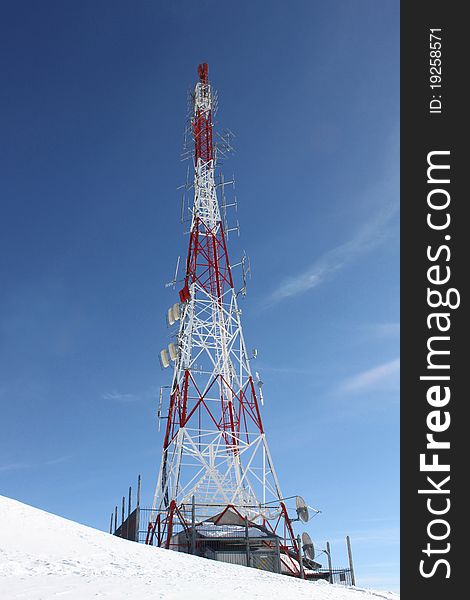 Meteorological weather station on the the top of the Alpine mountains in winter whith antennas. Meteorological weather station on the the top of the Alpine mountains in winter whith antennas