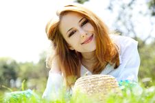 Red-haired Girl With Hat At The Park. Stock Photo Red-haired Girl With Hat At The Park. Stock Photo