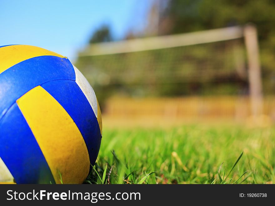 Ball on the grass over a blue sky