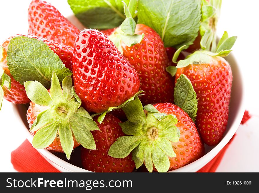 Photo of delicious red strawberries with mint leaves