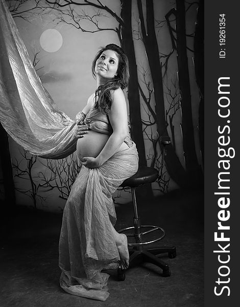 Portrait Of A Pregnant Woman On Black And White