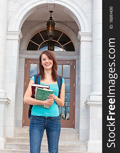 Student with books on campus. Student with books on campus