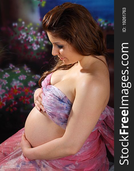 Over the shoulder view of a pregnant woman. Over the shoulder view of a pregnant woman