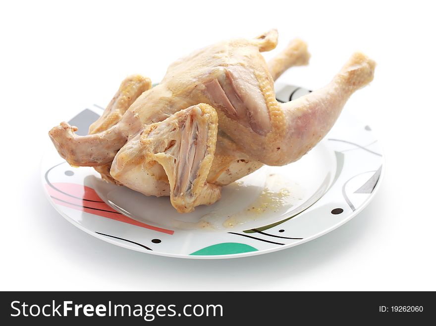 Close up of a whole chicken isolated over white background. Close up of a whole chicken isolated over white background.