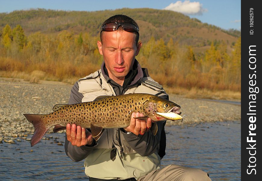 Fishing - fisherman catched big trout