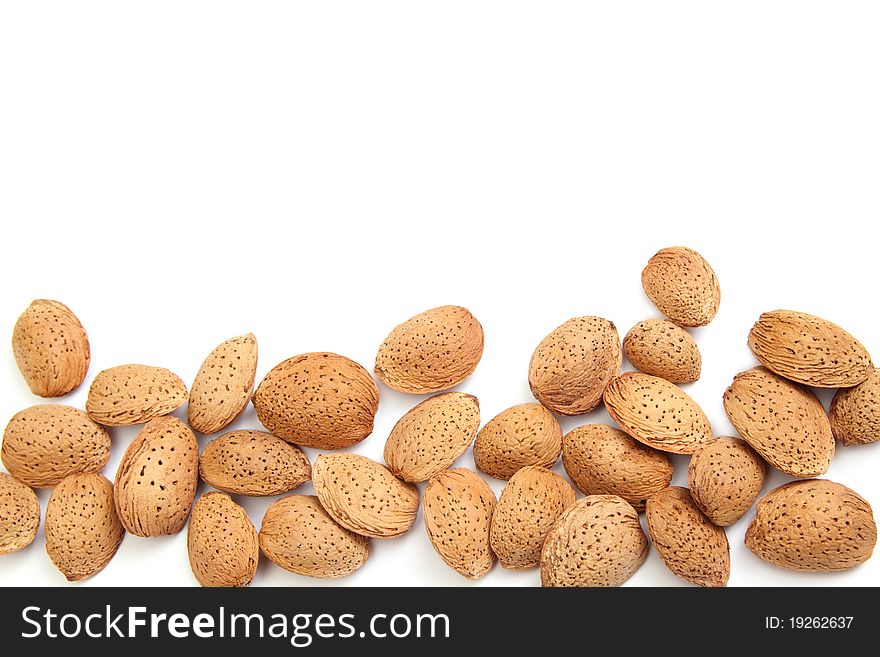 Fresh almond nuts isolated on white background with empty space for your notes