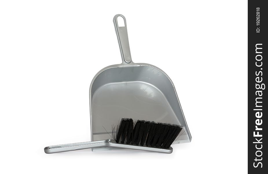 Gray plastic dustpan and scrub isolated on white background with clipping path. Gray plastic dustpan and scrub isolated on white background with clipping path