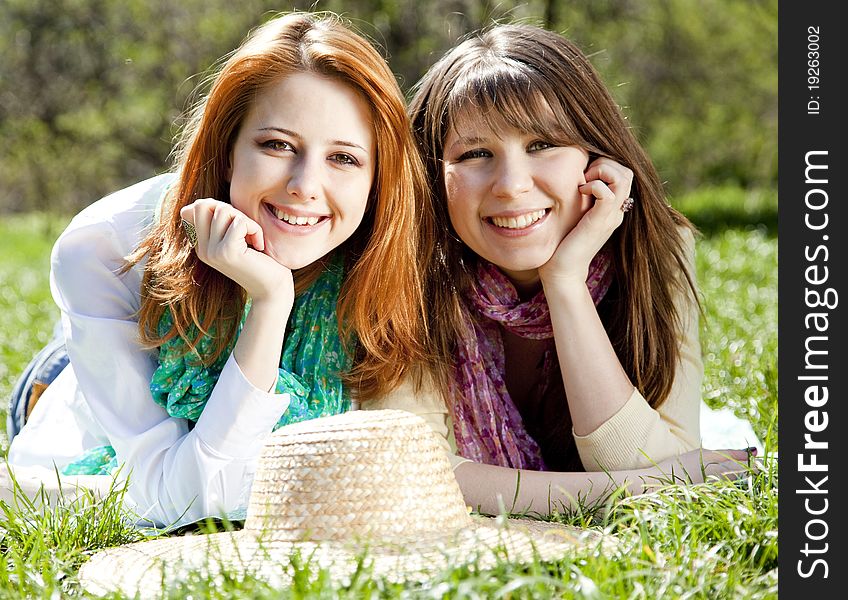 Girlfriends At Green Grass In The Park