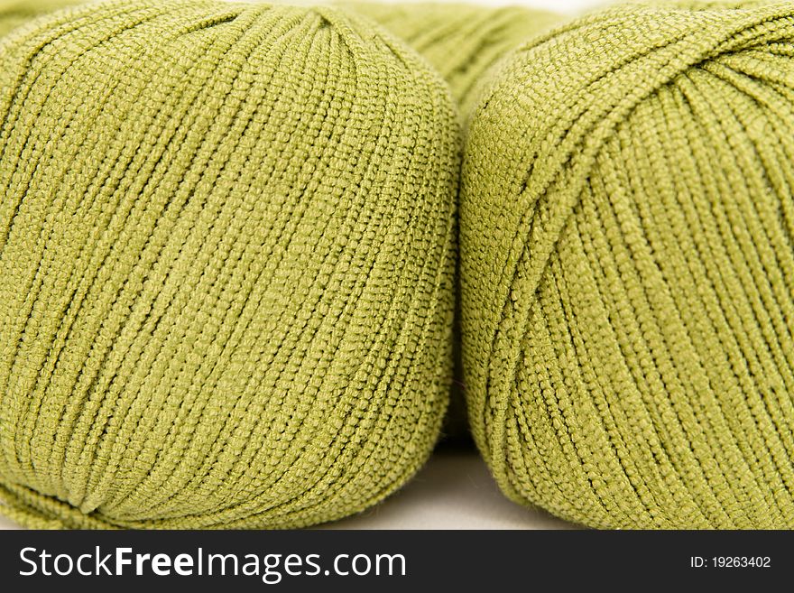 The green yarn skeins isolated on white