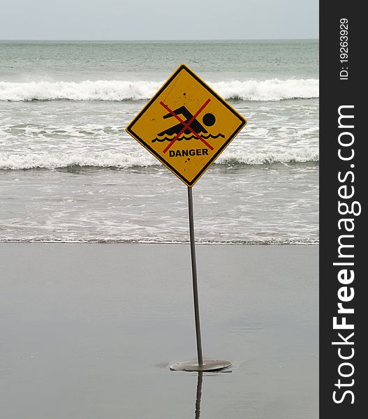 No swimming sign on the beach