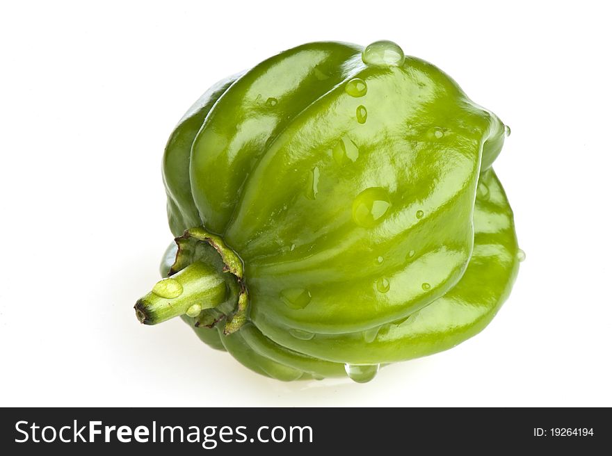 A small green bell pepper on white background Eastern. A small green bell pepper on white background Eastern