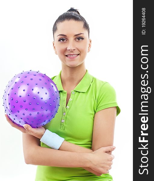 Smiling brunette woman with rubber ball, isolated. Smiling brunette woman with rubber ball, isolated