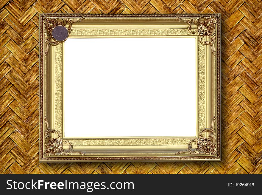 Gold picture frame on weave bamboo wall.