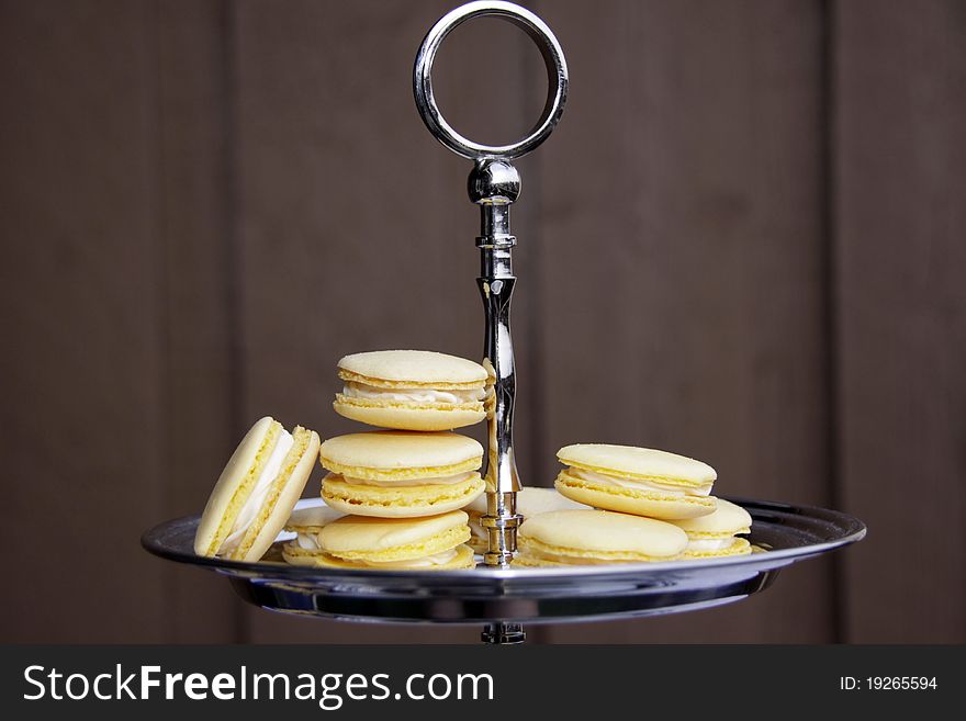 A plate of yellow macarons made for Easter. Filling inside is a cream cheese frosting with lemon tast.