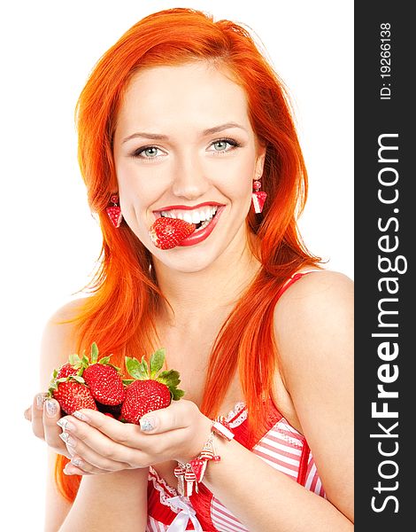 Portrait of redhead woman holding and biting strawberry. Portrait of redhead woman holding and biting strawberry