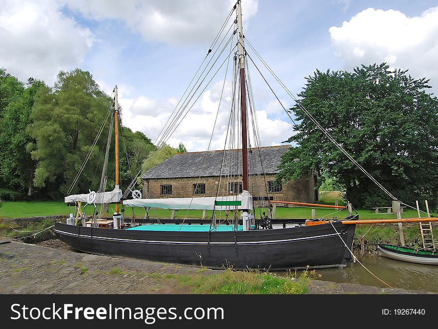 A Vintage Sailing Barge by a river in Devon