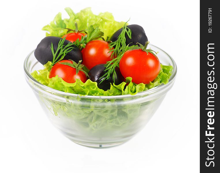 Fresh salad in a bowl with tomatoes and olives