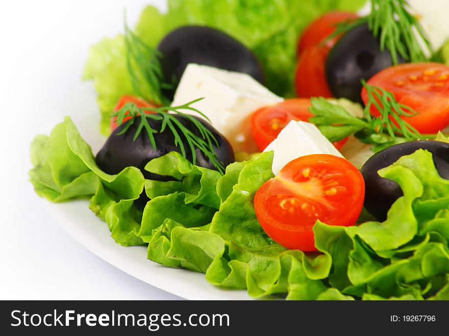 Fresh Greek salad with cheese, olives and tomatoes
