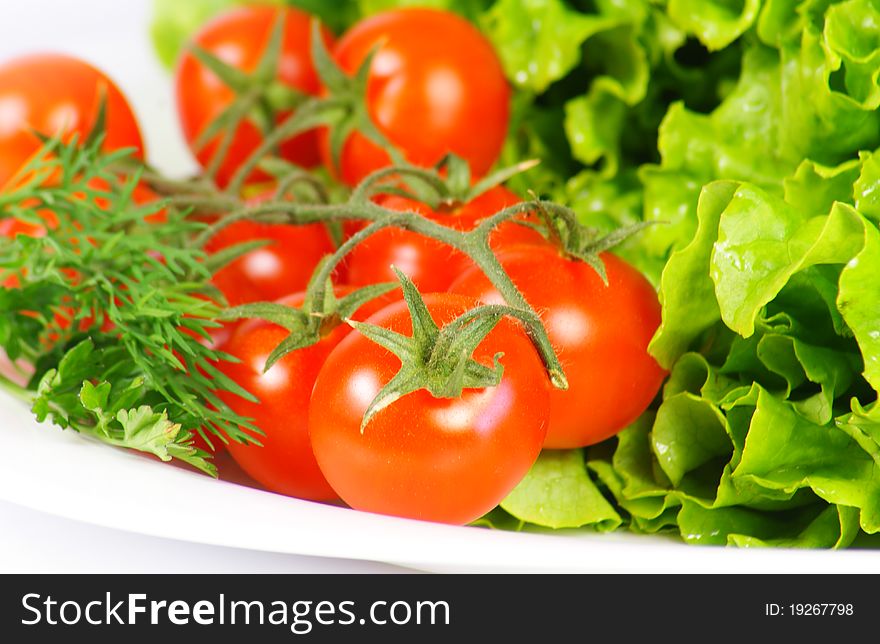 Ingredients for a fresh and healthy salad with tomatoes. Ingredients for a fresh and healthy salad with tomatoes