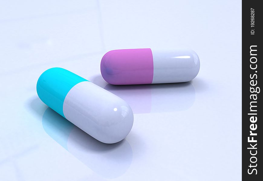 Shiny blue and pink pills on the white surface. Shiny blue and pink pills on the white surface