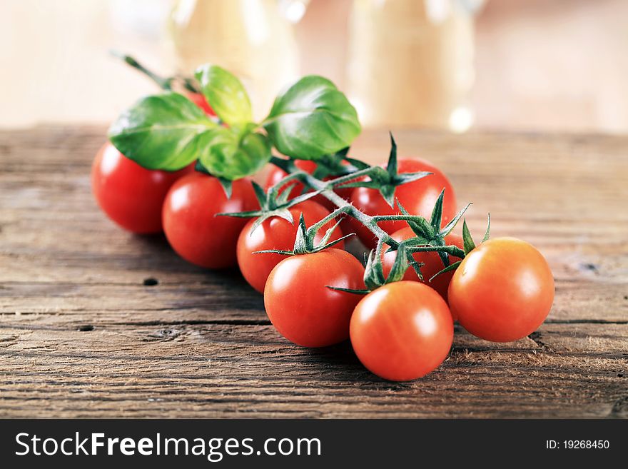 Bunch of red tomatoes on rough wood