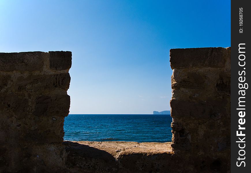 View through the ancient wall to the sea