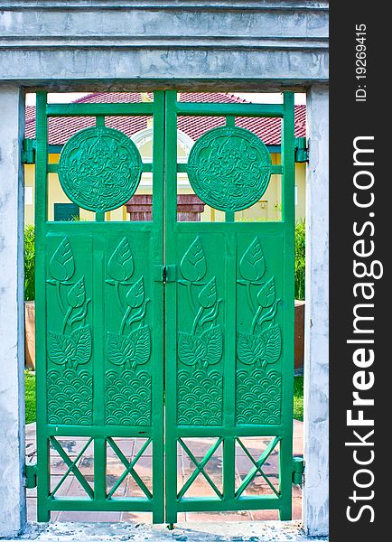 Green iron door with lotus picture