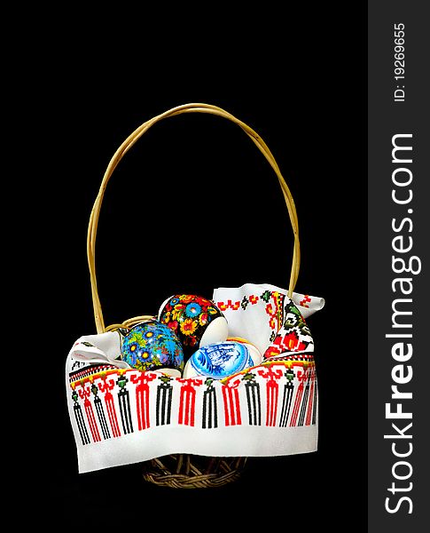 Basket with easter eggs isolated on black background. Basket with easter eggs isolated on black background