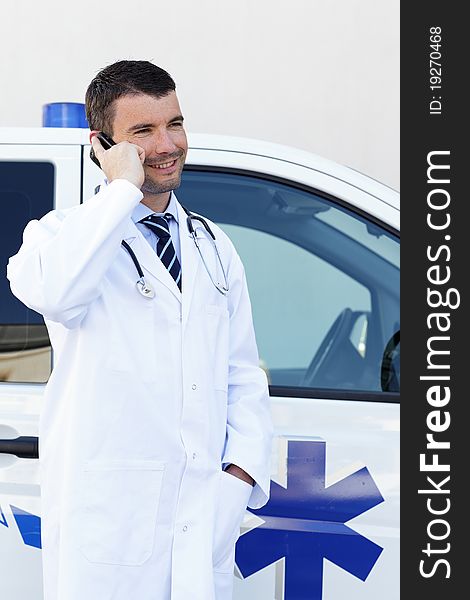 Doctor calling on the phone outdoor. Doctor calling on the phone outdoor