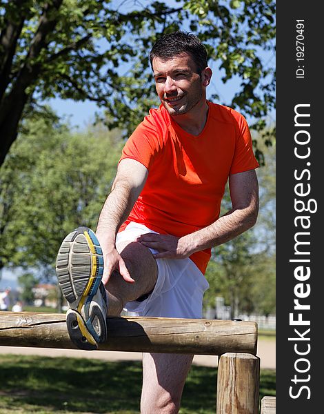 Man stretching outdoor in summer. Man stretching outdoor in summer