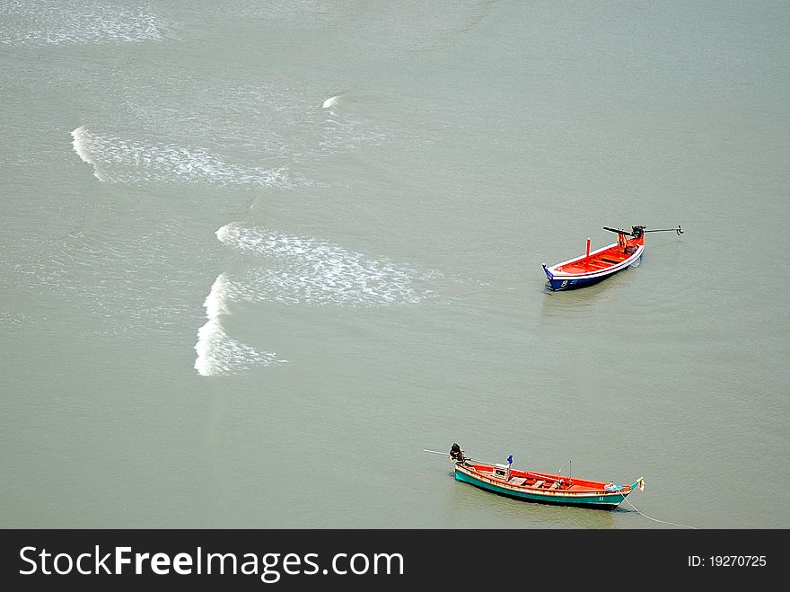 Two fishing boats floating in the sea