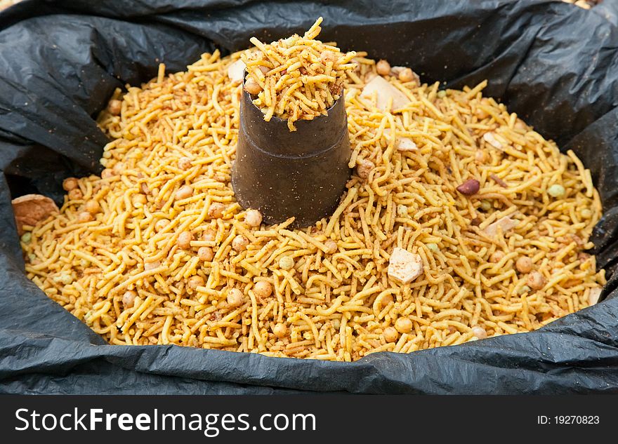 Nepali snacks in a black plastic bag