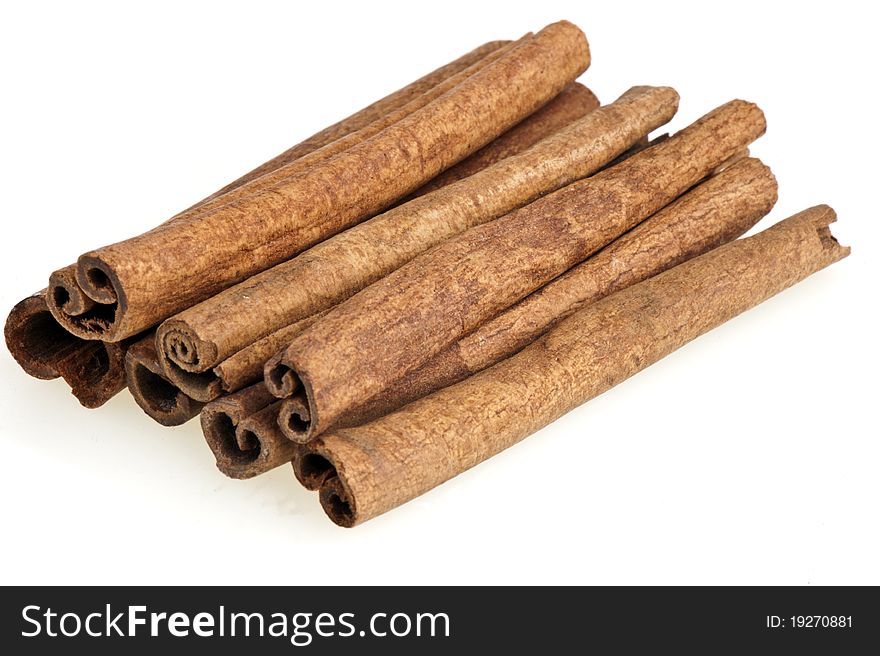 Some cinnamon sticks on a white background