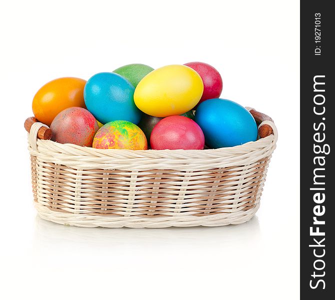 Easter Eggs in basket (isolated on white)