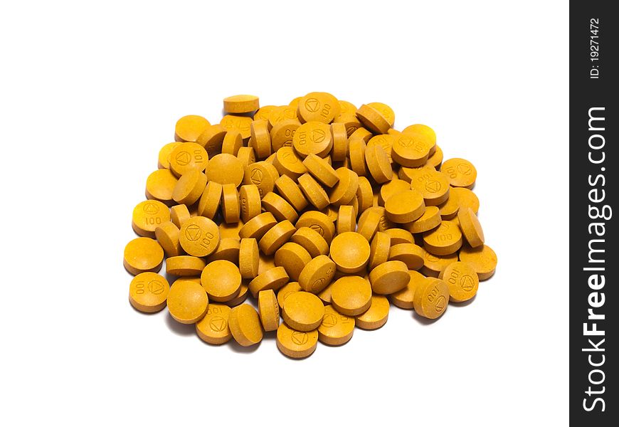 Stash of vitamin C pills against Isolated on a white background. Stash of vitamin C pills against Isolated on a white background